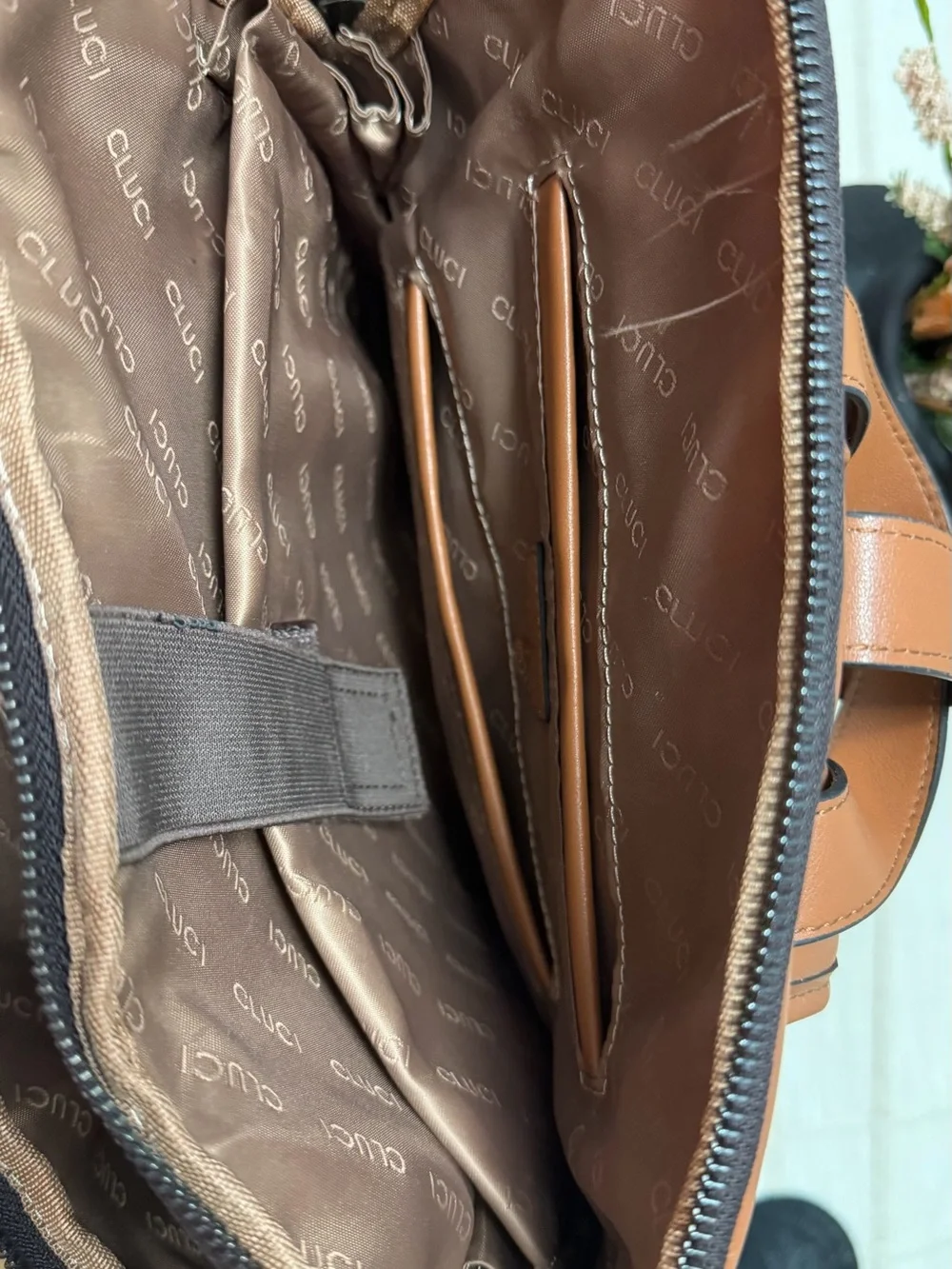 Cluci laptop Backpack with Crescent Pattern and different pockets.